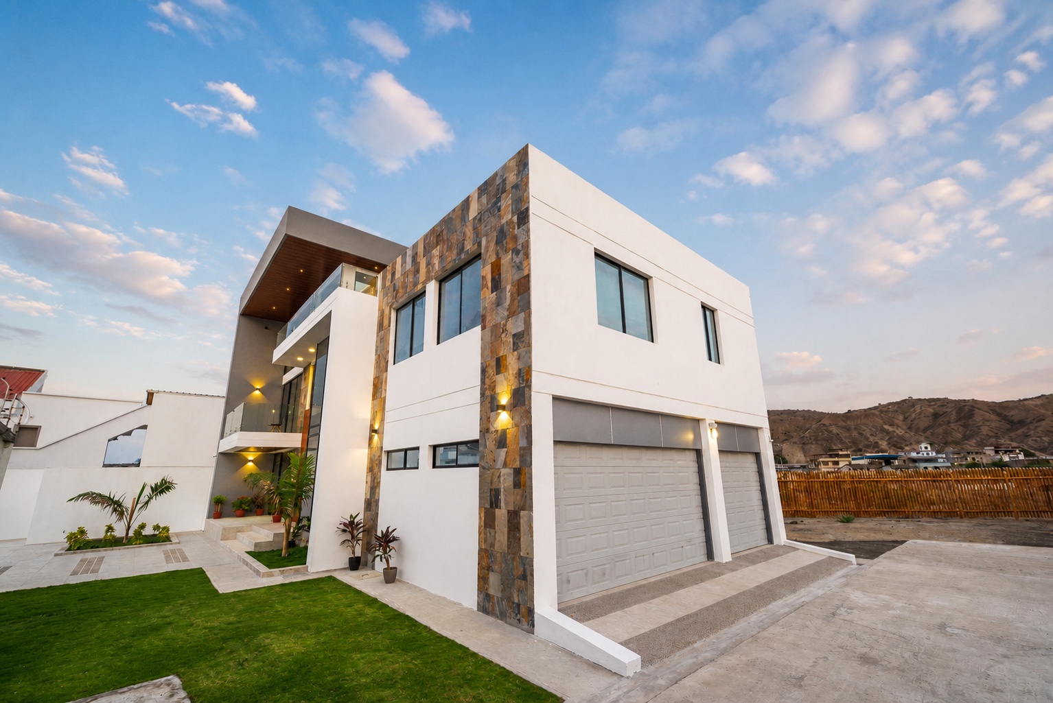 Modern Santa Marianita villa exterior with stone accents at sunset
