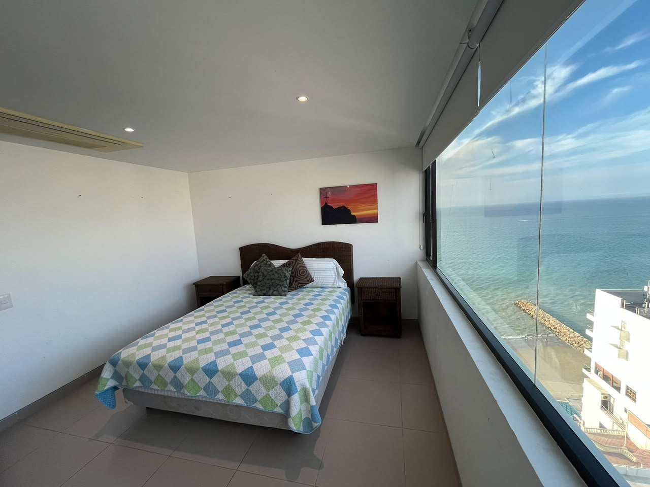 Bright ocean-view bedroom overlooking the Pacific coast in Manta