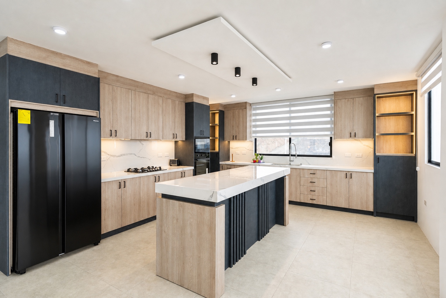 Fully equipped chef's kitchen with a large island and illuminated shelving