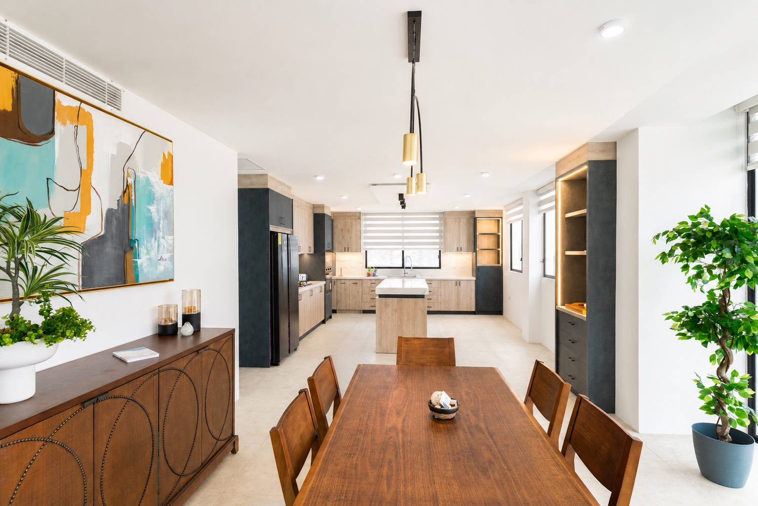 Dining table overlooking the spacious kitchen at the Santa Marianita villa