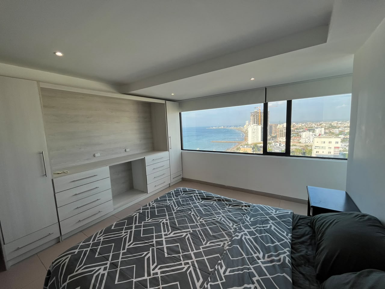 Ocean-view bedroom with built-in wardrobe and storage