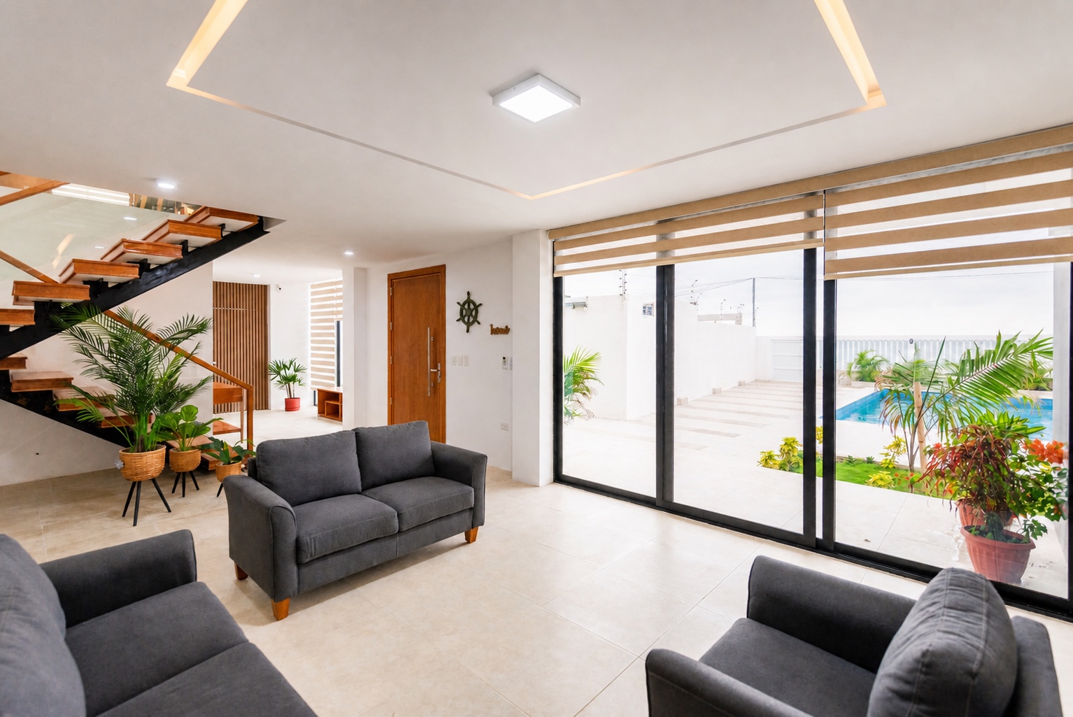 Open living room with direct access to the private pool and patio