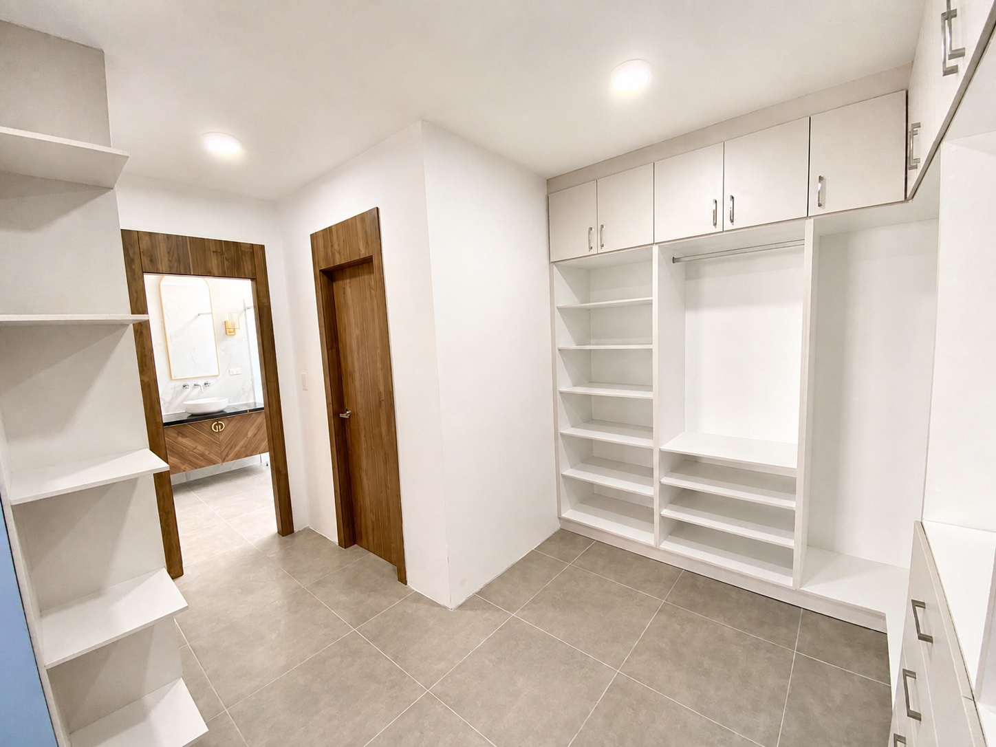 Spacious dressing room connected to the luxury bathroom