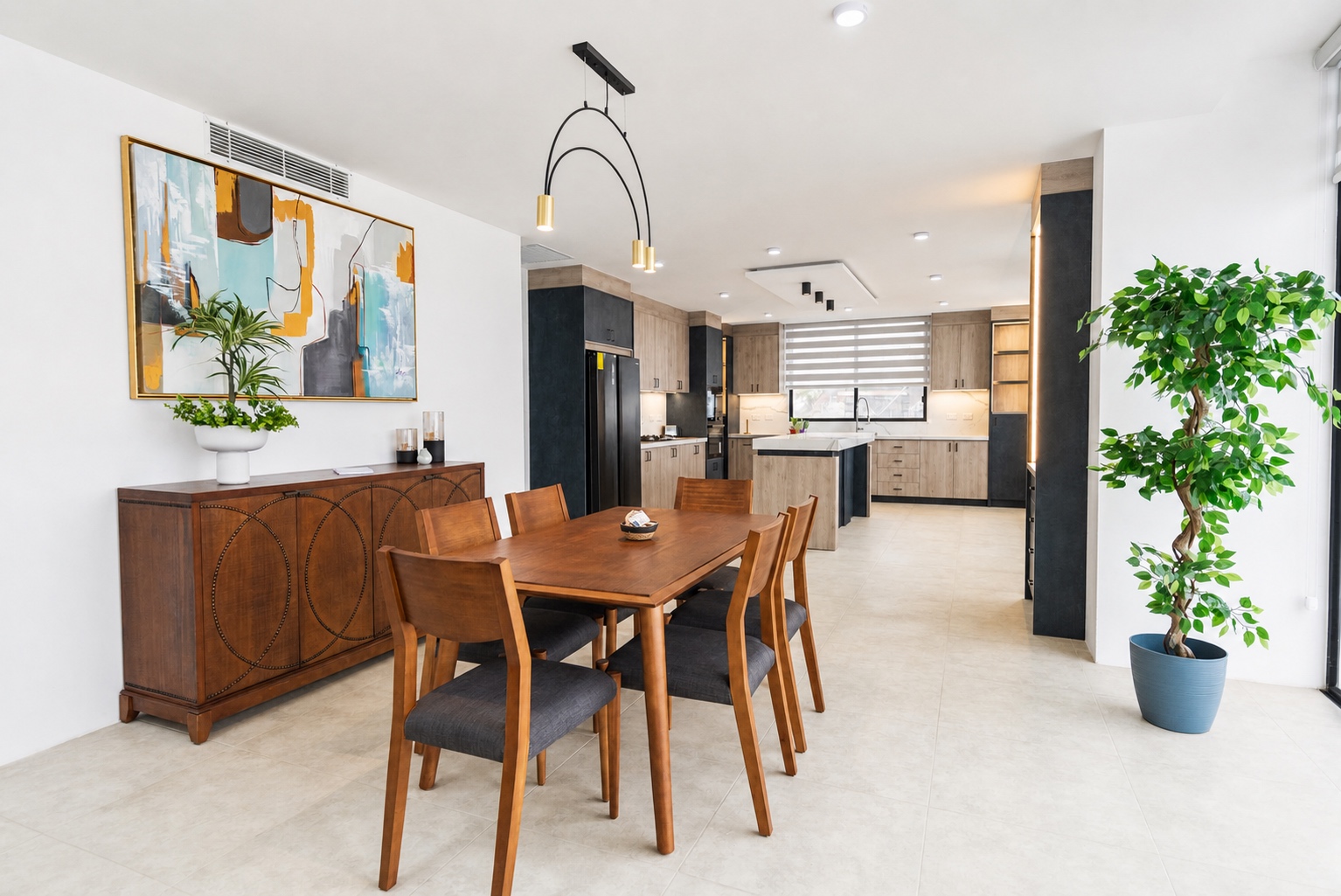 Wood dining room opening into the modern kitchen at the Santa Marianita villa