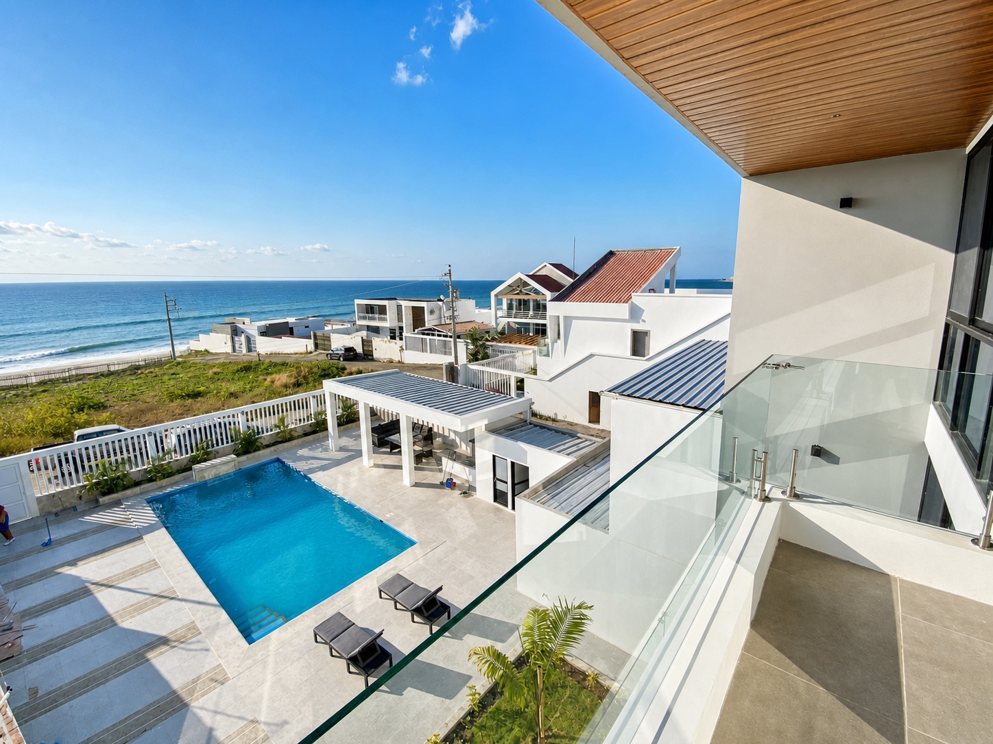 Upper balcony overlooking the private pool and Pacific Ocean