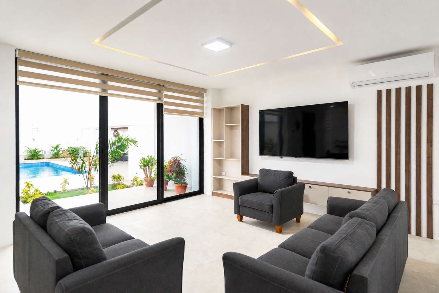 Pool-view living room with large glass doors and modern seating