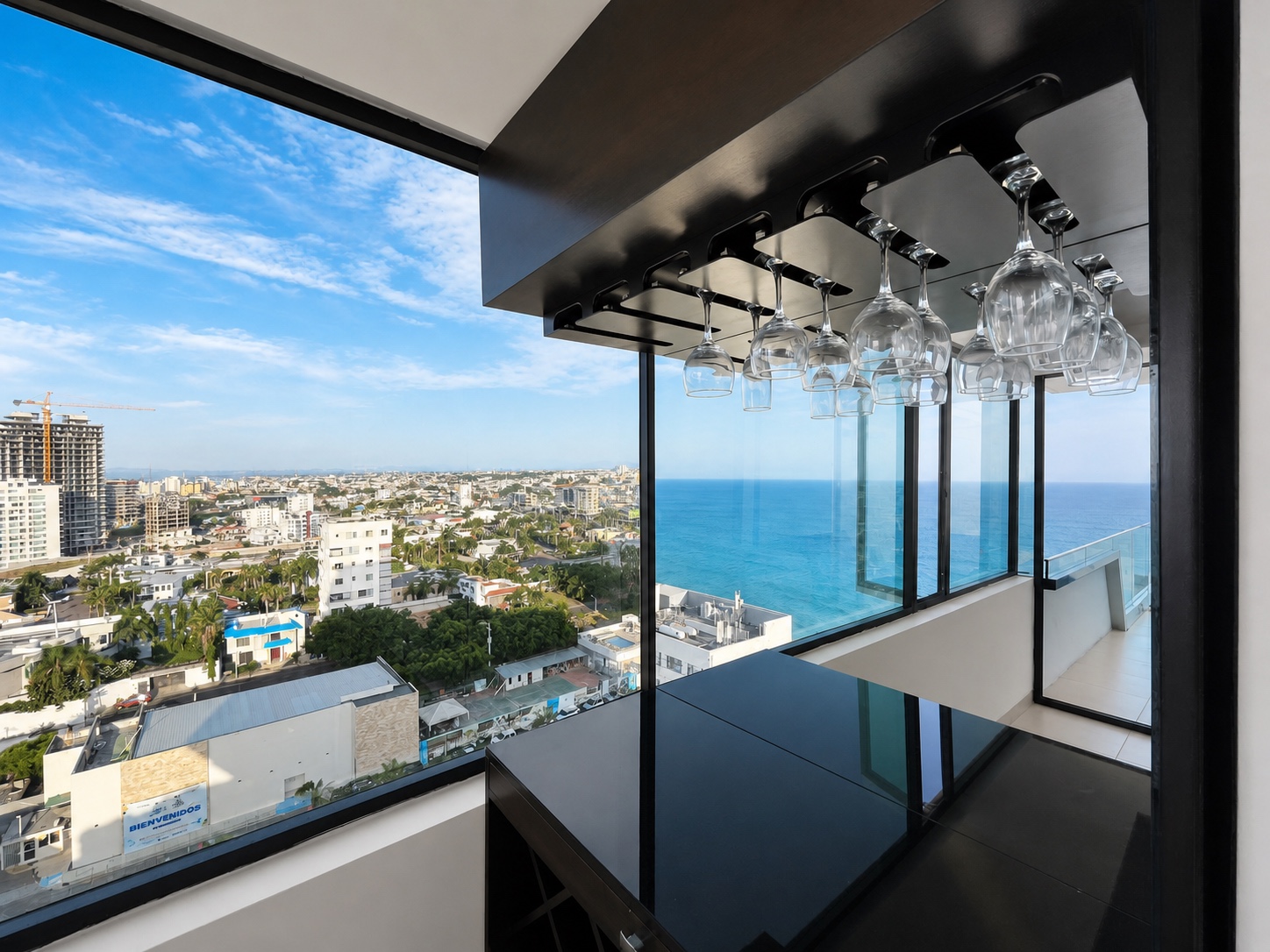 Wine bar with glass rack overlooking the Manta coastline and Pacific Ocean