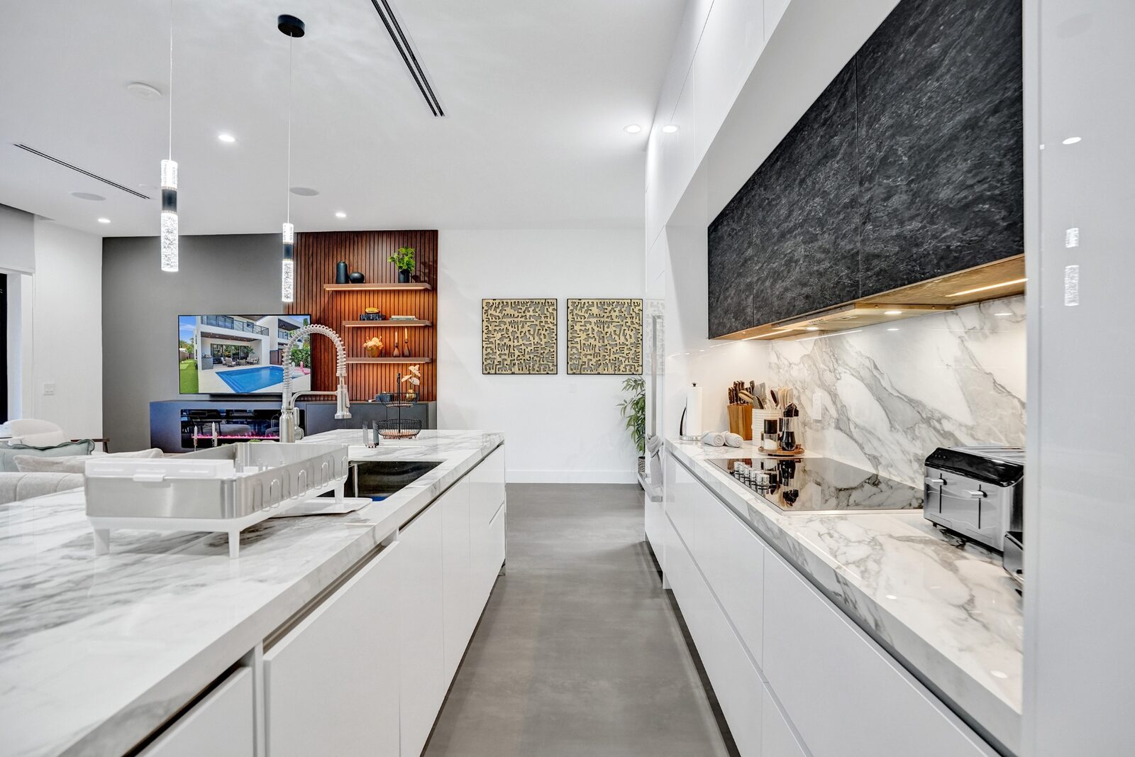 Galley-style chef's kitchen with marble countertops and premium appliances